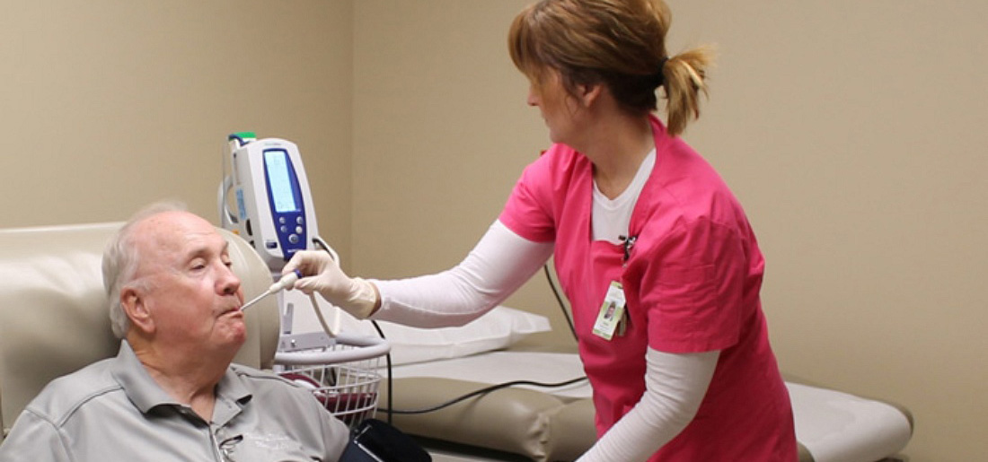 outpatient clinic nurse taking temperature