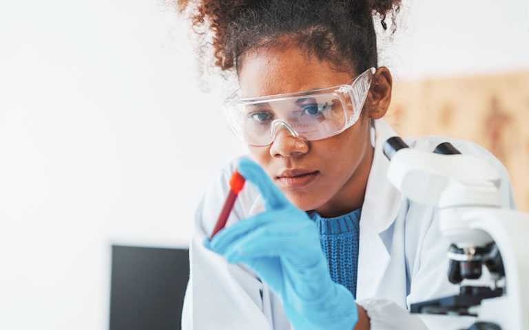 Discounted Lab Vouchers at Salem Township Hospital Glove holding a test tube