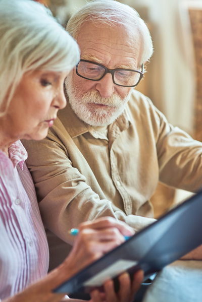 Elderly Couple reviewing Care Options
