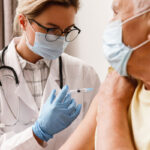 Stock photo of person receiving a vaccine