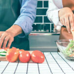 Two people preparing a healthy meal.